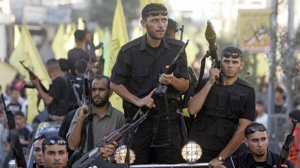 Supporters and armed members of the Fatah movement protest against the Palestinian Hamas government during a rally in Jabalya camp September 22, 2006.