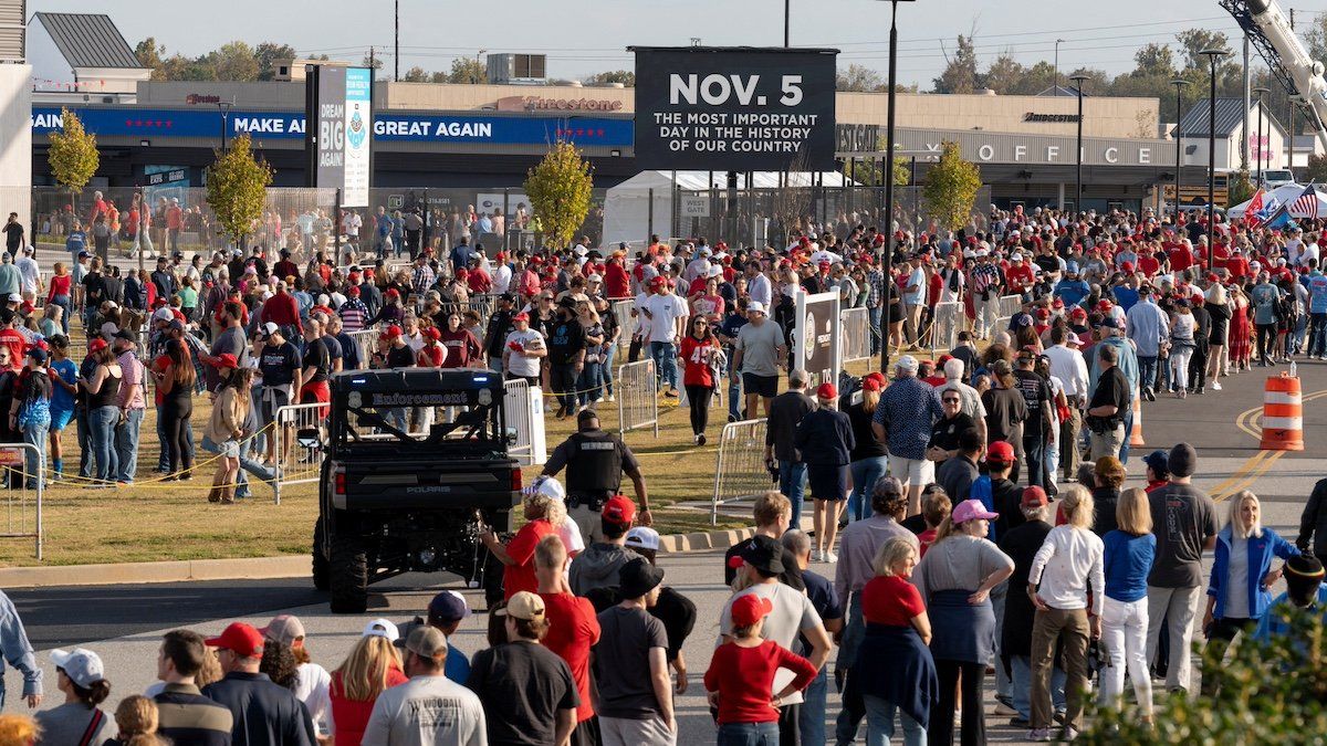 Supporters of Republican presidential nominee and former U.S. President Donald Trump wait in line to attend a campaign rally in Macon, Georgia U.S., November 3, 2024. 