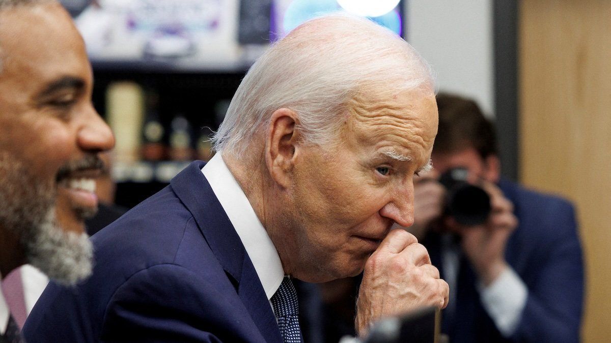 U.S. President Joe Biden rubs his nose while greeting shoppers inside Mario's Westside Market grocery store in Las Vegas, Nevada, U.S., July 16, 2024.