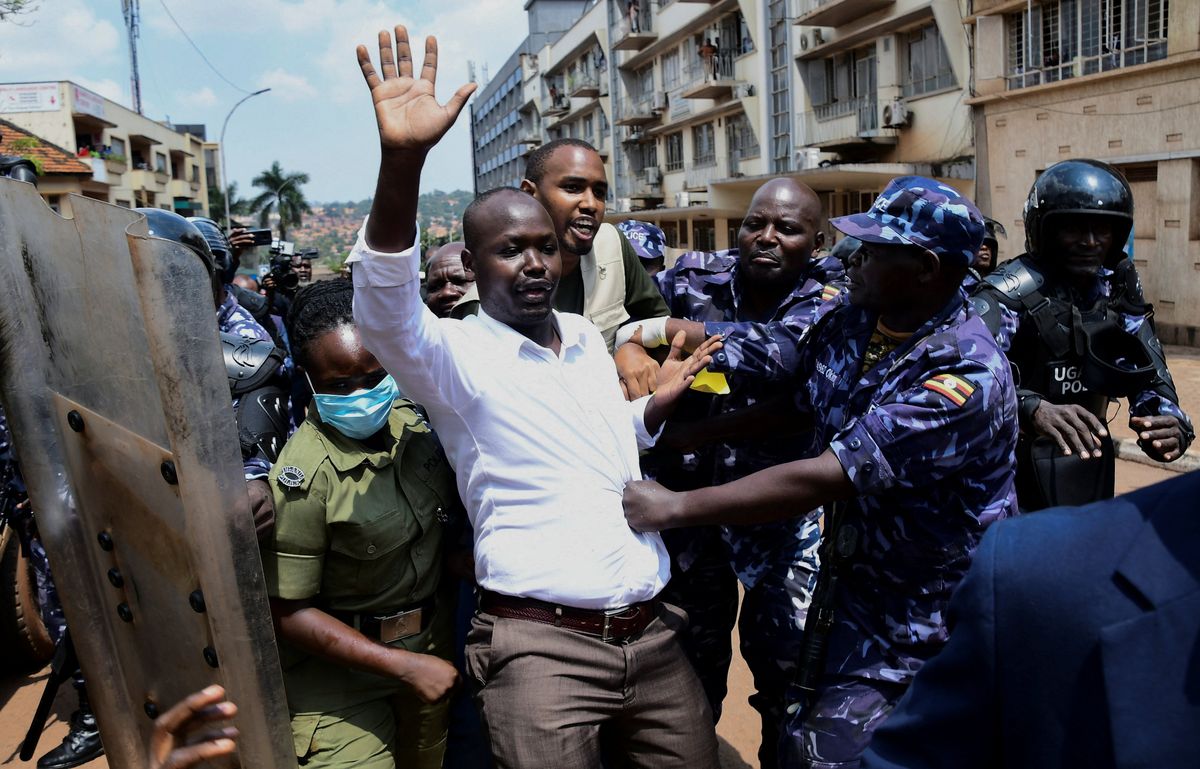 Ugandan police officers detain protestors during a rally against what the protesters say are rampant corruption and human rights abuses by the country's rulers in Kampala, Uganda July 23, 2024.