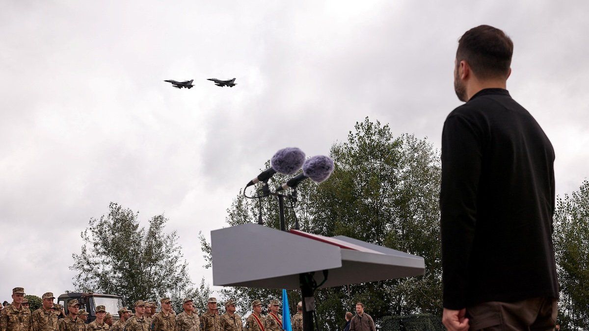 Ukraine's President Volodymyr Zelensky looks at F-16 fighting aircrafts during marking the Day of the Ukrainian Air Forces, amid Russia's attack on Ukraine, in an undisclosed location, Ukraine, August 4, 2024. 