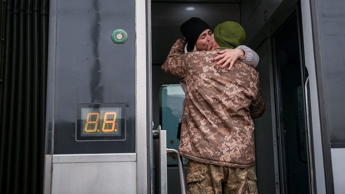 Ukrainian serviceman kisses his wife who was visiting him during a short break from his frontline duty, amid Russia’s attack on Ukraine, at the train station in Kramatorsk, Ukraine February 14, 2024. 