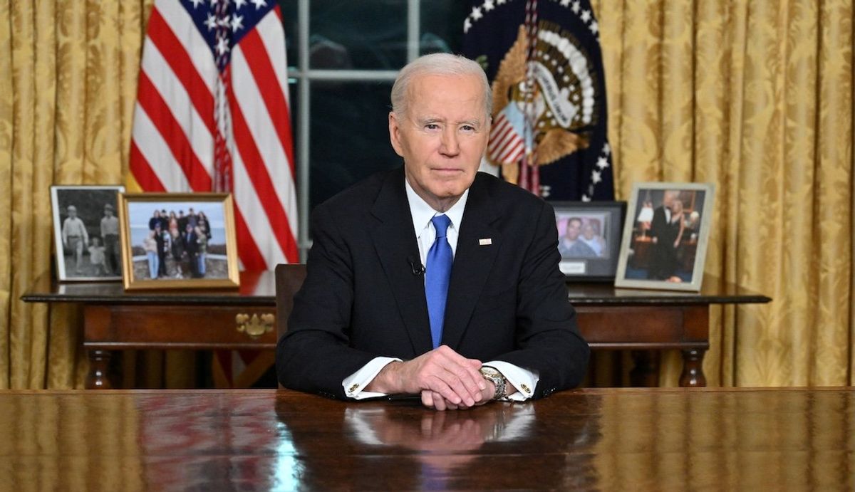 ​US President Joe Biden looks on after he delivered his farewell address to the nation from the Oval Office of the White House in Washington, DC, on Jan. 15, 2025.